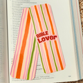 Striped bookmark with 'BIBLE Lover' text on an open book